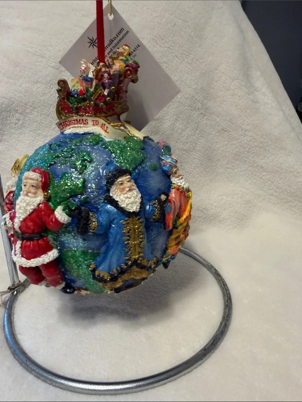 Christopher Radko Santa’s around the world with tag